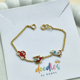 Travel Trio Charm Bracelet 2.38 grams. 18kt gold